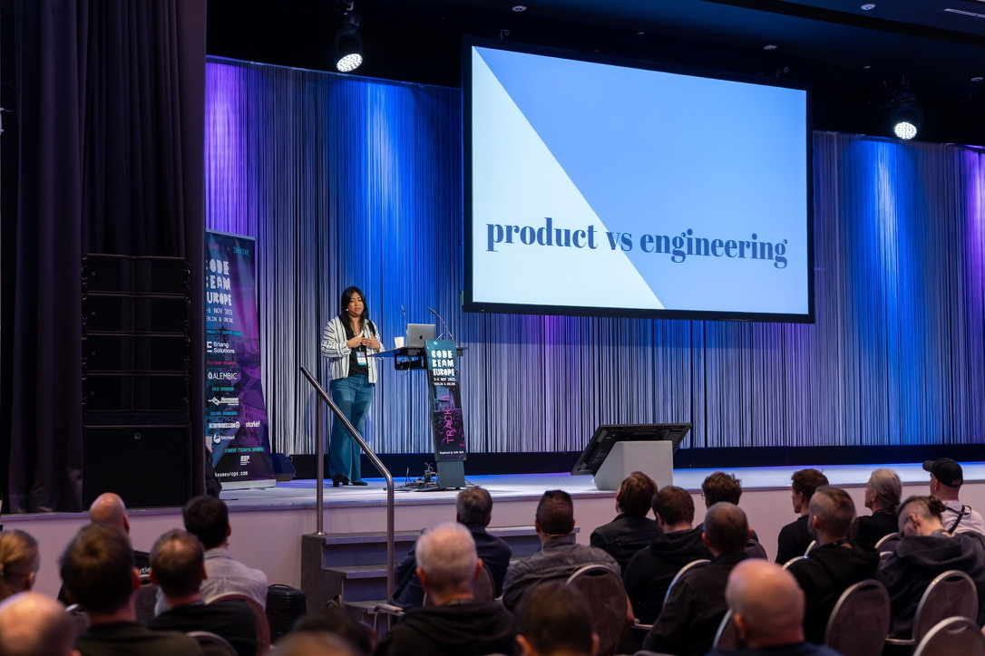 Sundi speaking on stage at Code BEAM Europe 2025 in Berlin