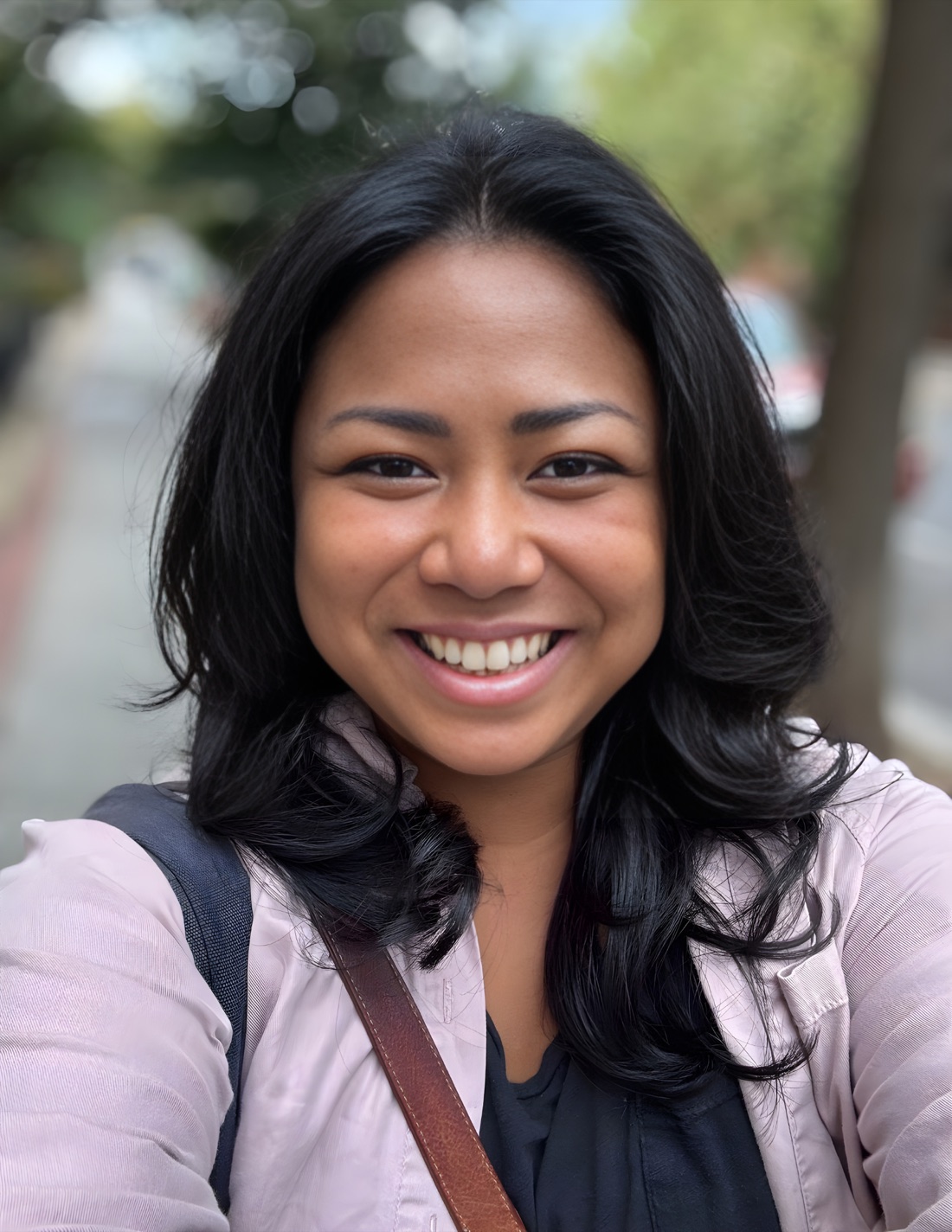 Sundi Myint smiling outdoors